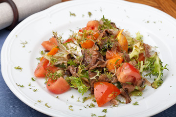 Tofu marinated in soy sauce with tomato and salad