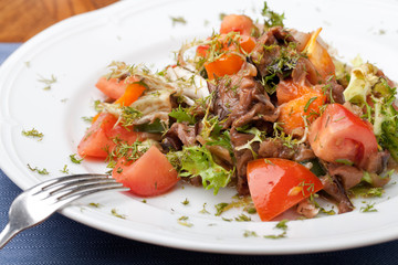 Tofu marinated in soy sauce with tomato and salad