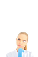 Thoughtful female doctor isolated over a white background