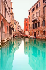 Tuinposter Venice, Canal with bridge detail. Long exposure photography. © stevanzz