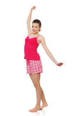 Naklejka premium Young teen woman in pink pajamas
