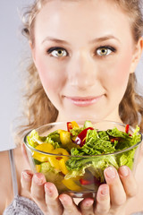 Happy healthy woman with salad