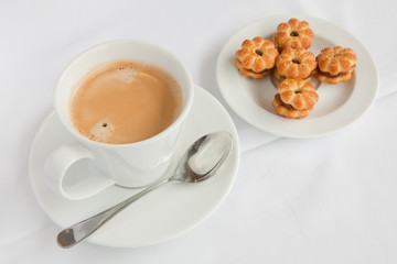 cup of coffee with cracker