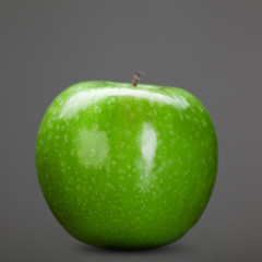 green apple isolated on grey