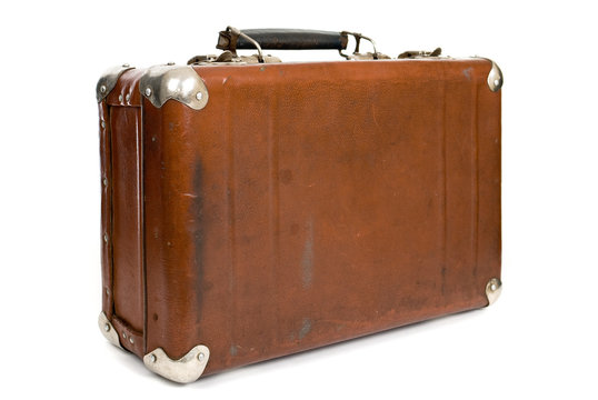 Old suitcase isolated on a white background