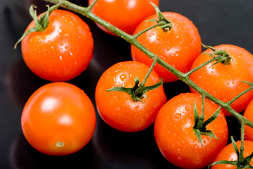 Cherry tomatoes in a black plate