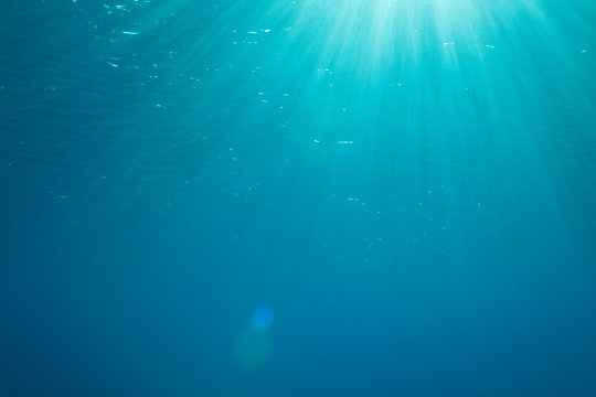 background with sunbeams underwater
