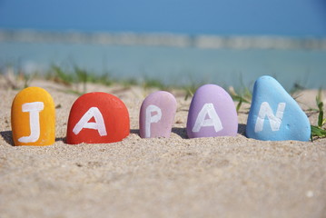 painted pebbles with the name of Japan
