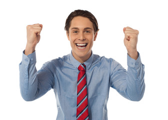 Businessman celebrating success with arms raised