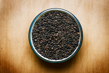 black pepper on wood table