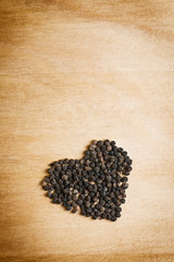 black pepper on wood table