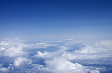 Fototapeta na wymiar Deep blue clouds. Shoot from the plane.