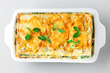 Spinach lasagna with basil and oregano Isolated.