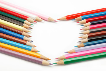 colored pencils crayons composed in the form of heart