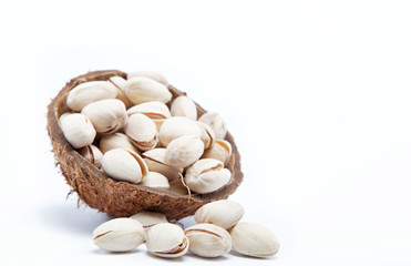 Pistachio nuts in the shell of the coconut.