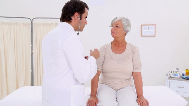 Serious mature woman being examined