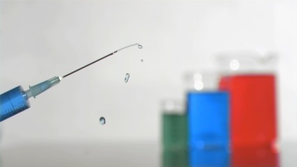 Syringe jet in super slow motion falling in the air - Powered by Adobe