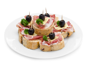 Group of sandwich appetizers with ham and cheese