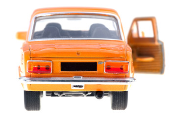 Orange car with open door on white background, back.