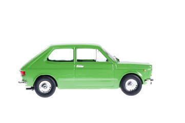 Little green old car on white background.