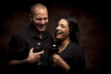 Happy Mixed Race Couple Holding Wine Glasses