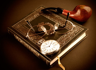 pocket watch, glasses and book