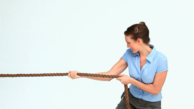Woman in suit pulling a rope 