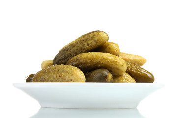 Marinated cucumbers on the plate isolated on white