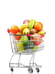 Assortment of exotic fruits  in shopping cart isolated on white