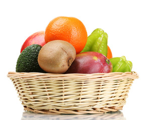 Assortment of exotic fruits in basket isolated on white