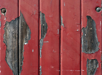 Wall with flaking red paint