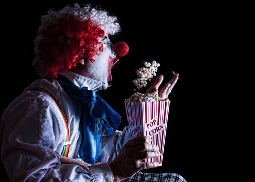 clown eating popcorn