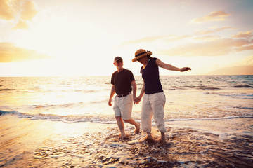 Senior Couple Enjoying Sunset at the Beach