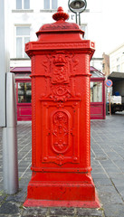 historical and ornate red hydrant in Brugge