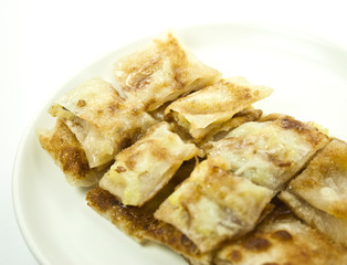dessert style of fried roti with banana inside in Thailand