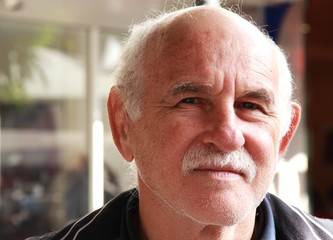 handsome elderly man in the street. portrait