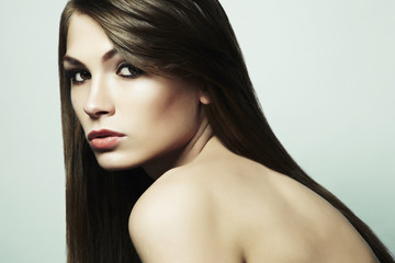 Fototapeta premium Fashion photo of a young woman with dark hair