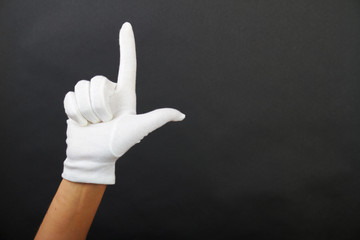 hand of a woman is showing two fingers
