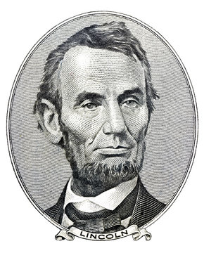 president Abraham Lincoln as he looks on five dollar bill
