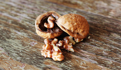 walnut on wooden background. soft focus