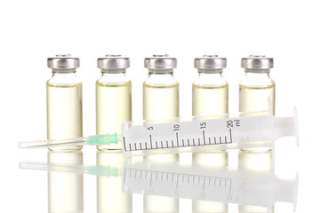 Syringe and medical ampoules isolated on white