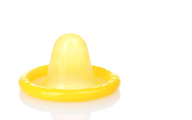 Yellow condom isolated on white
