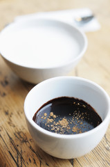 Obraz na płótnie Canvas Hot chocolate with spice and milk in white cups
