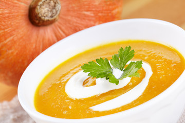 Pumpkin soup in white plate