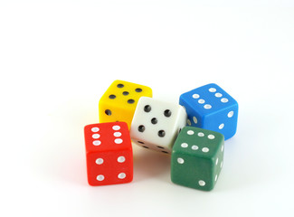 Five color dice over white