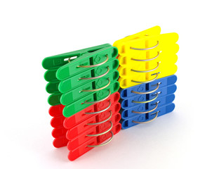 Fototapeta premium Color clothes-pegs over white