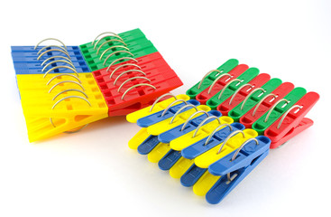 Color clothes-pegs over white