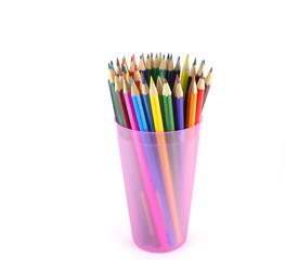Color pencils in the pink prop over white