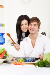 young couple in kitchen