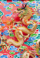 chinese dragon statue  on temple wall in Thailand
